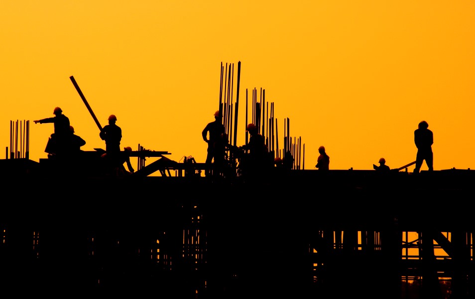 Construction workers sunset